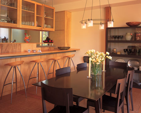 As these homeowner-architects designed their home in a grid pattern, they gave more space to the family areas and melded the dining room and kitchen.